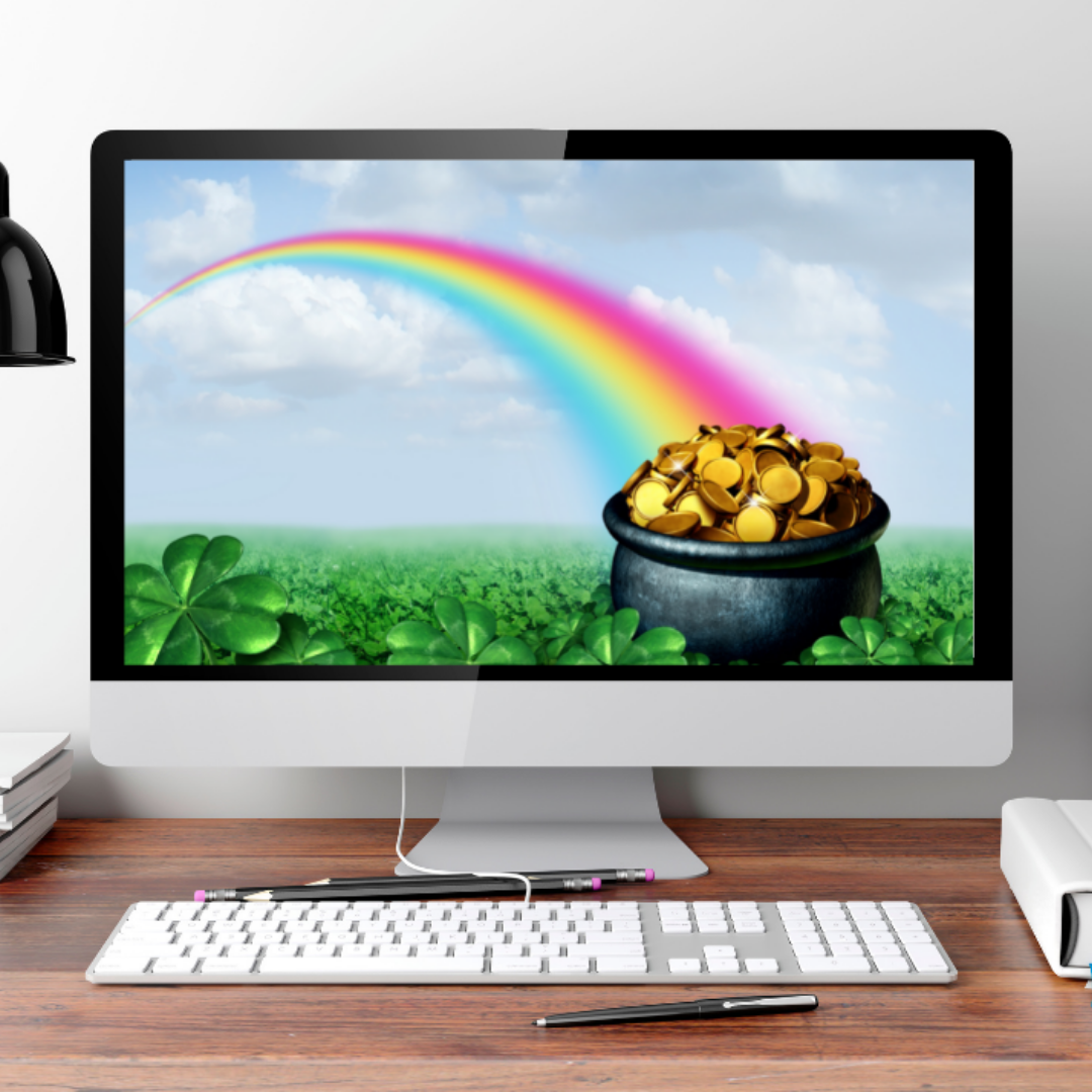 Desktop computer showing an image of a pot of gold and rainbow